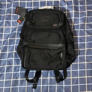 Tumi Black Backpack with Multi-Compartment Design